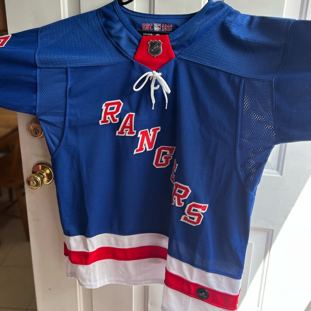 Authentic NYR Reaves jersey. Brand new. Tags on. Size Large.